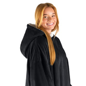 An adult with a hooded wearable blanket on