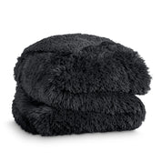 A shaggy faux fur blanket folded