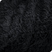 Close up of the soft texture of a shaggy faux fur sherpa blanket