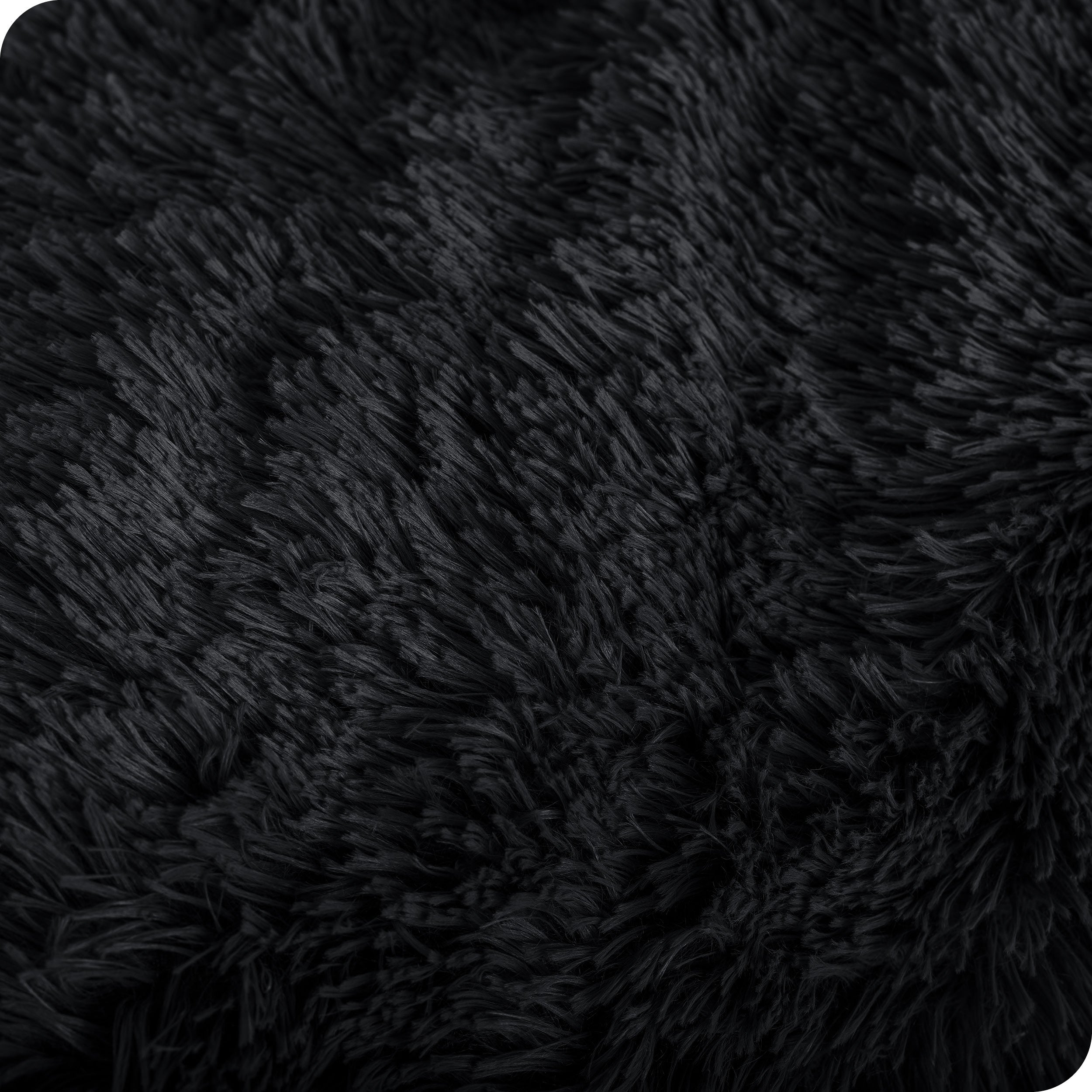 Close up of the soft texture of a shaggy faux fur sherpa blanket