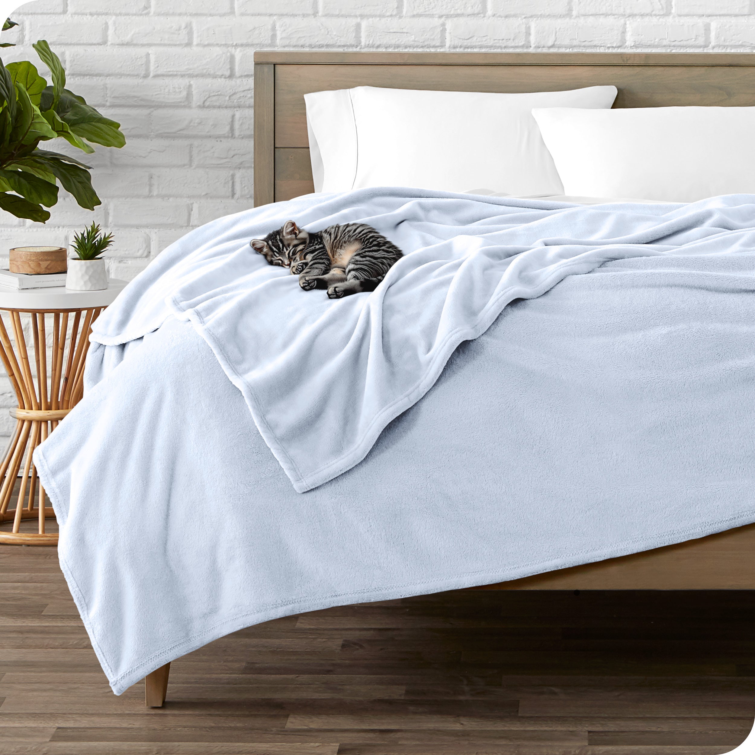 Microplush blanket laid out over a bed and folded back over itself