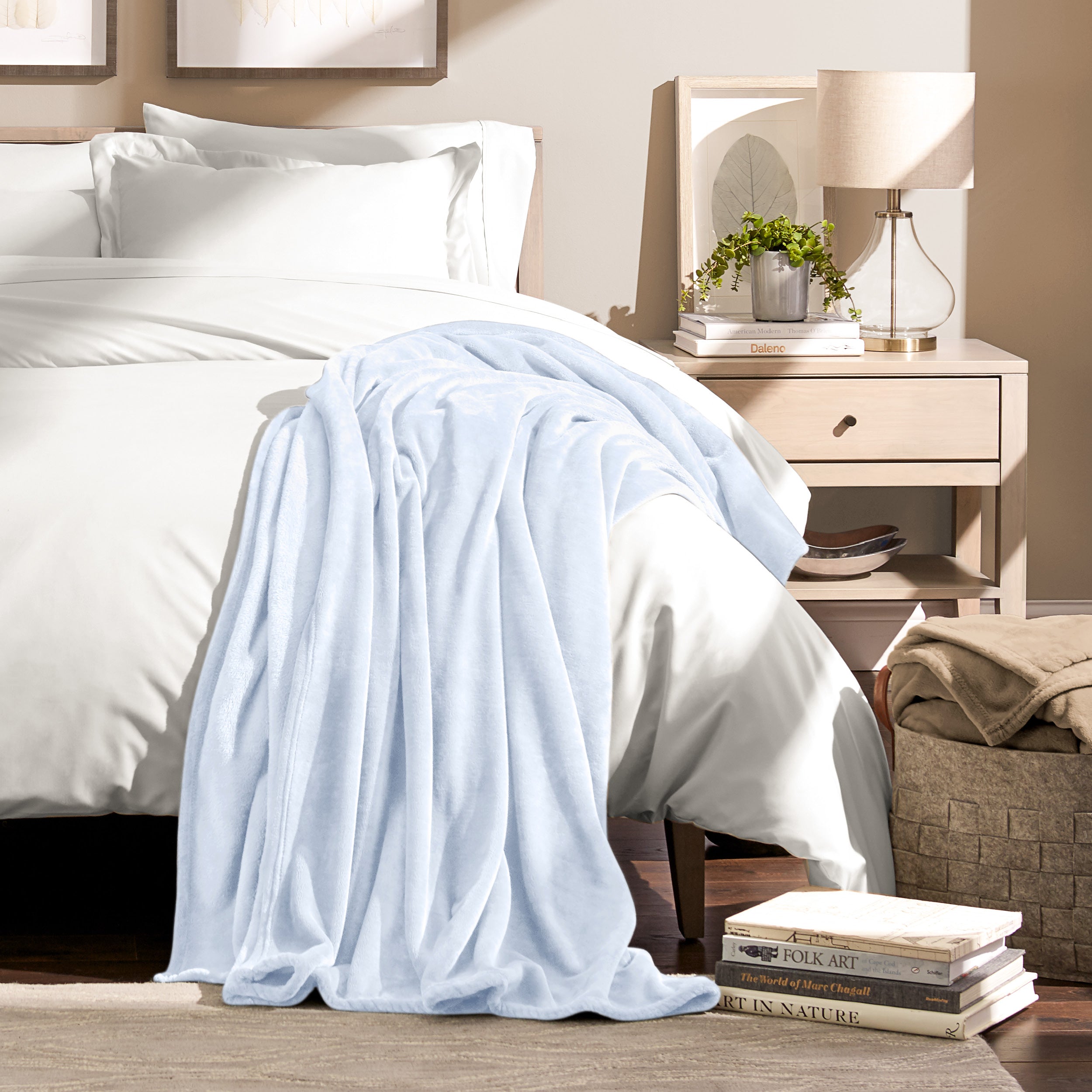 Microplush blanket laid out over a bed and folded back over itself