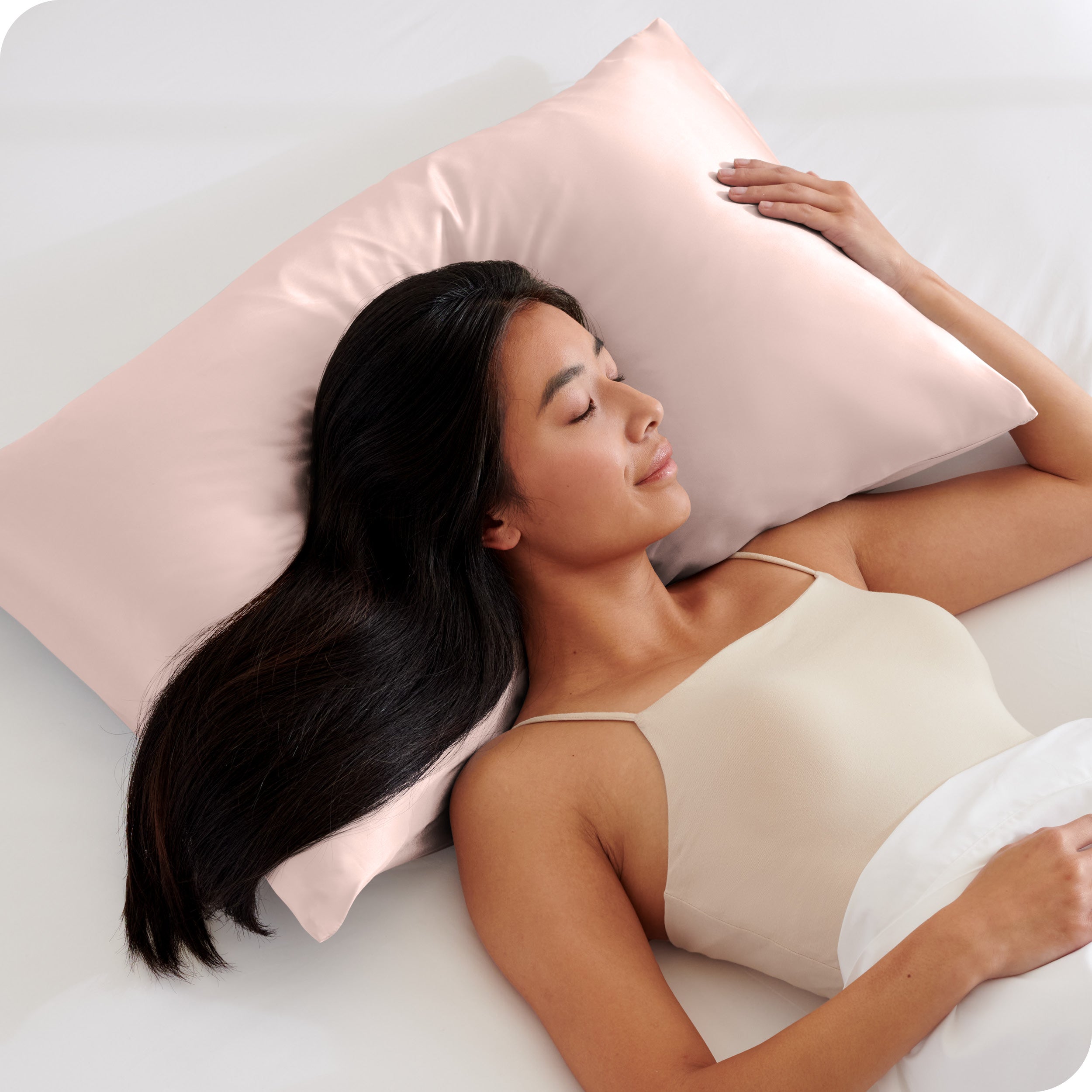 A woman sleeping on a silk pillowcase