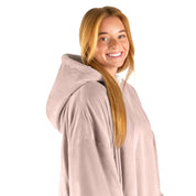 An adult with a hooded wearable blanket on