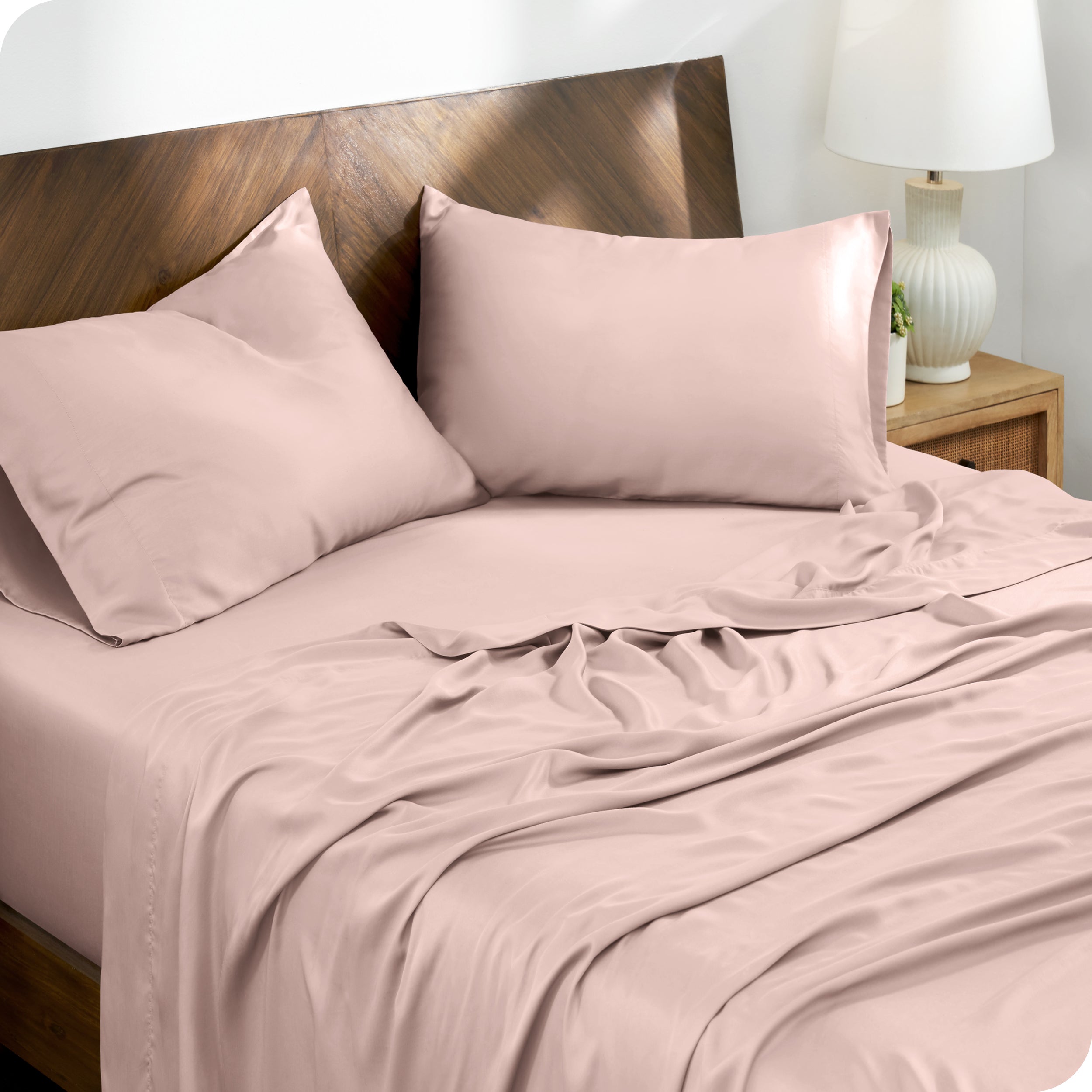 TENCEL™ Lyocell sheets on a bed. The flat sheet is folded over itself slightly.
