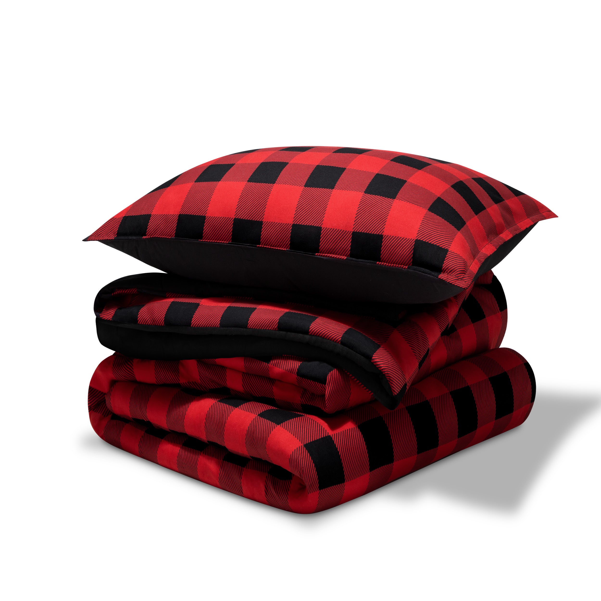 A comforter folded with a matching pillow sham stacked on top