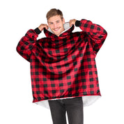 An adult with a sherpa wearable blanket on