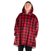 An adult with a sherpa wearable blanket on