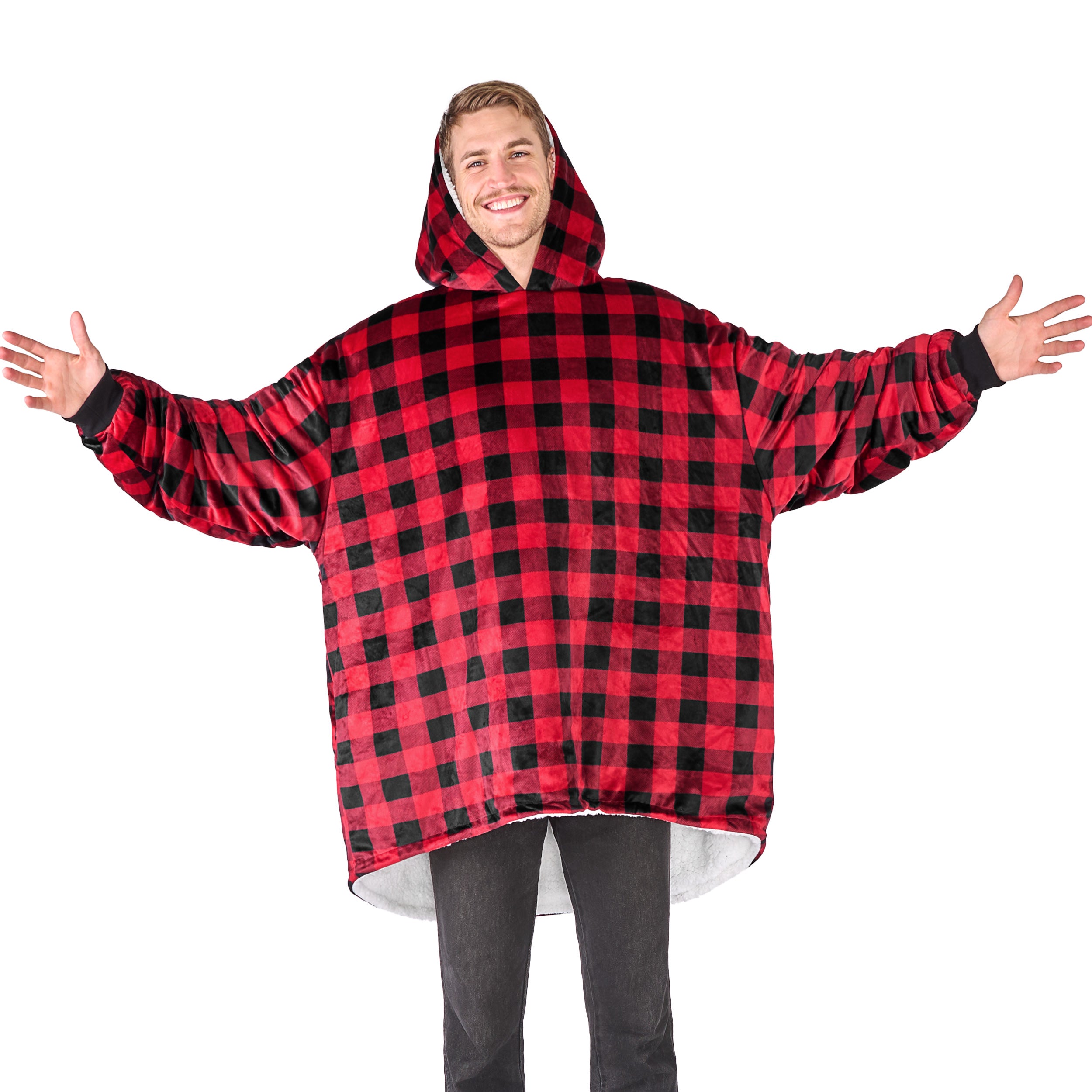 An adult with a hooded wearable blanket on