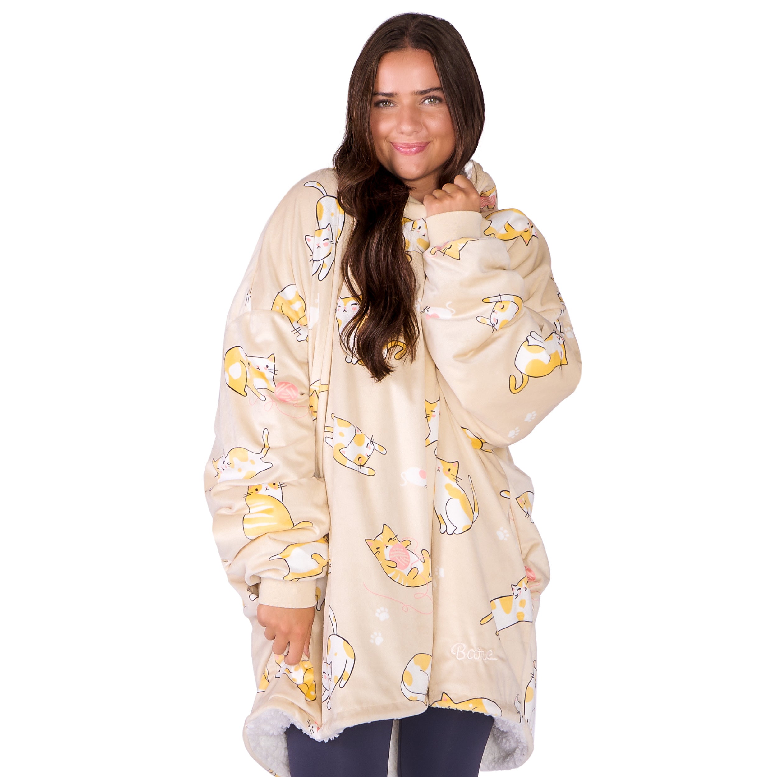 An adult with a sherpa wearable blanket on