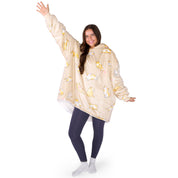 An adult with a hooded wearable blanket on
