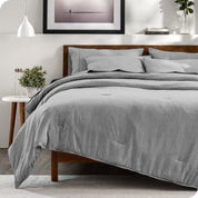 A bedding set on a bed in a modern bedroom