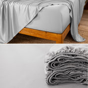 Bamboo fitted sheet on a wooden bed with a close-up of the folded sheet below.