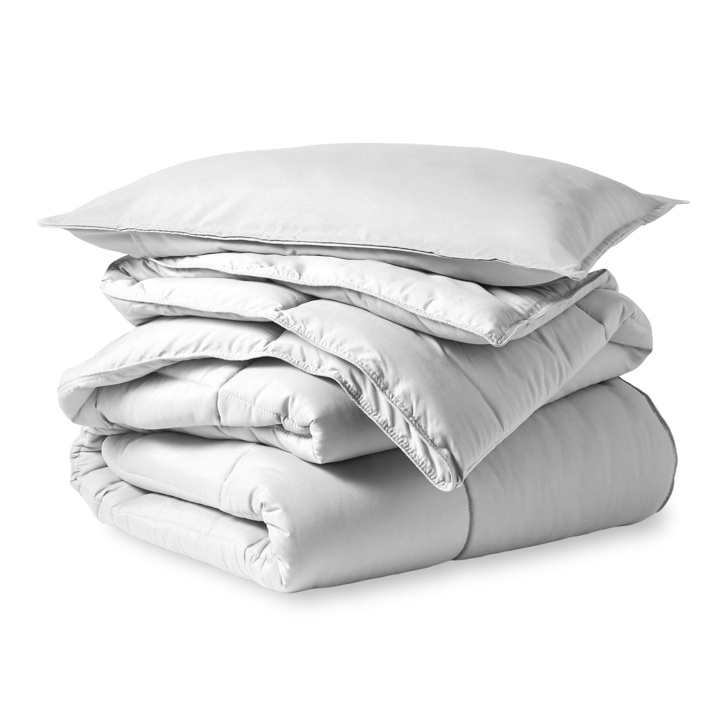 A microfiber comforter folded neatly with a pillow from above