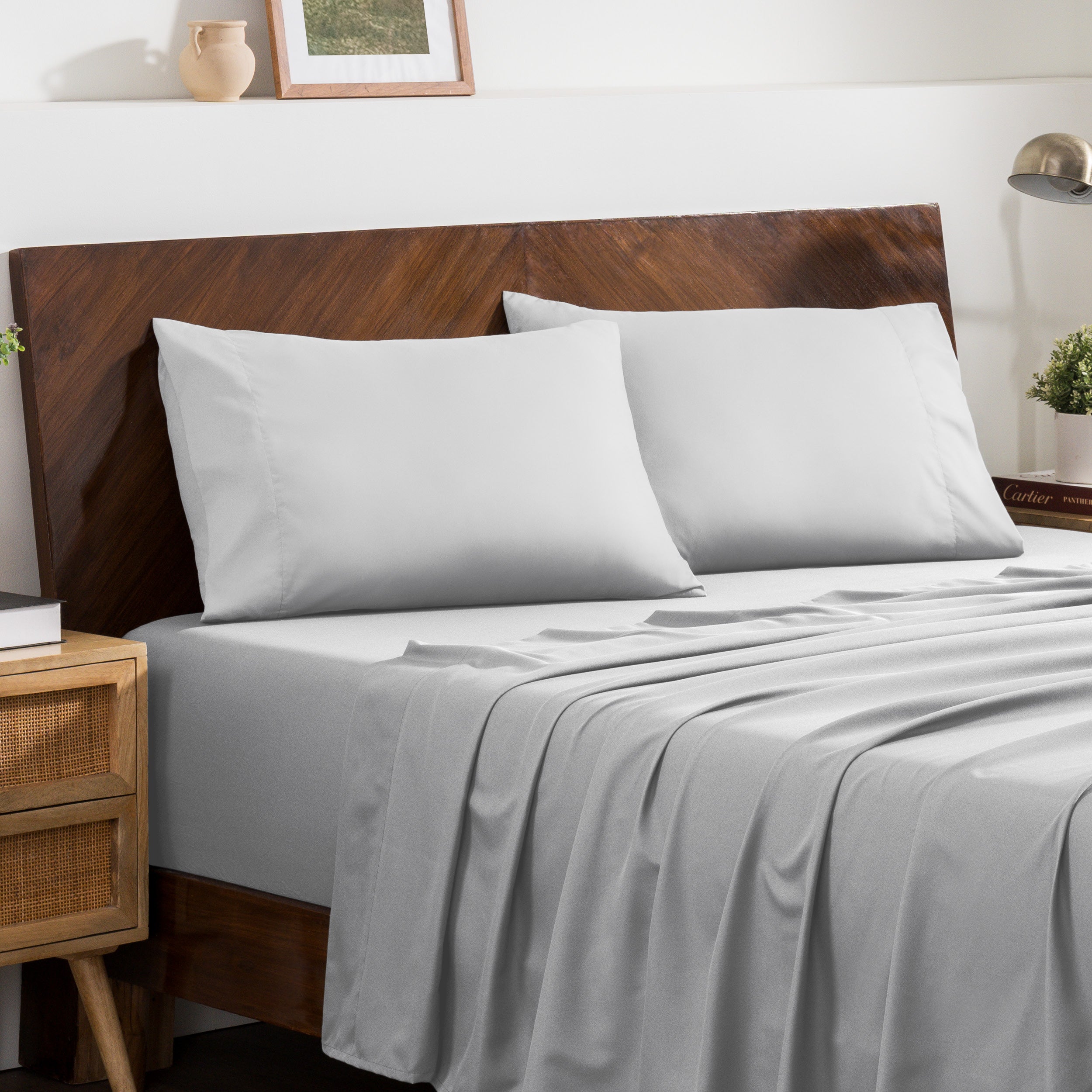 2 pillowcases on pillows on a nicely made bed