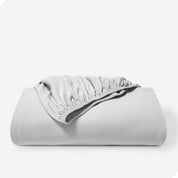 A single organic cotton fitted sheet folded