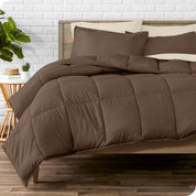 A wooden bed frame with sheets, pillow shams and a comforter on the bed