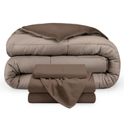 A reversible microfiber comforter and a coordinating sheet set folded and stacked 