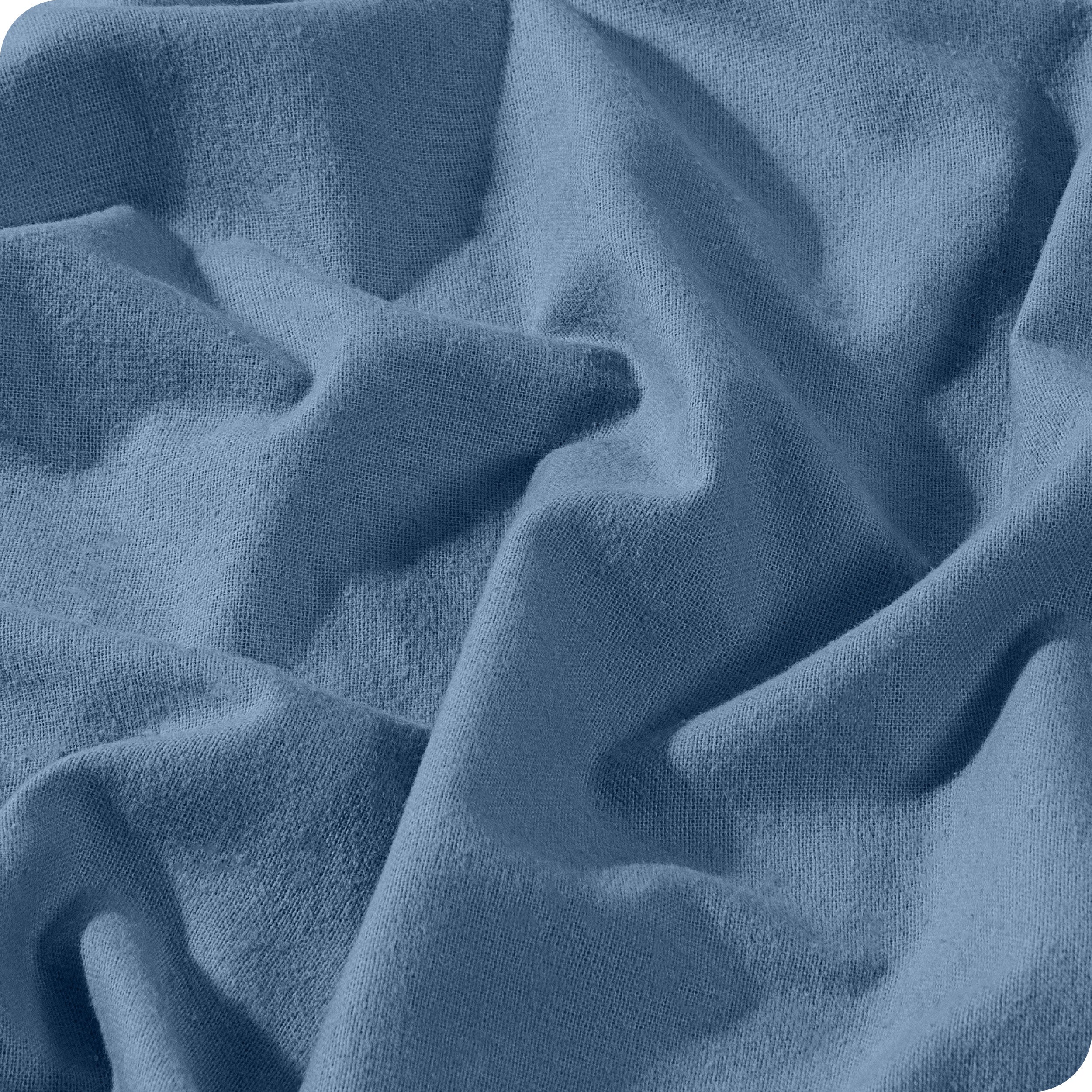 A close view of a button and lining on the flannel duvet cover.