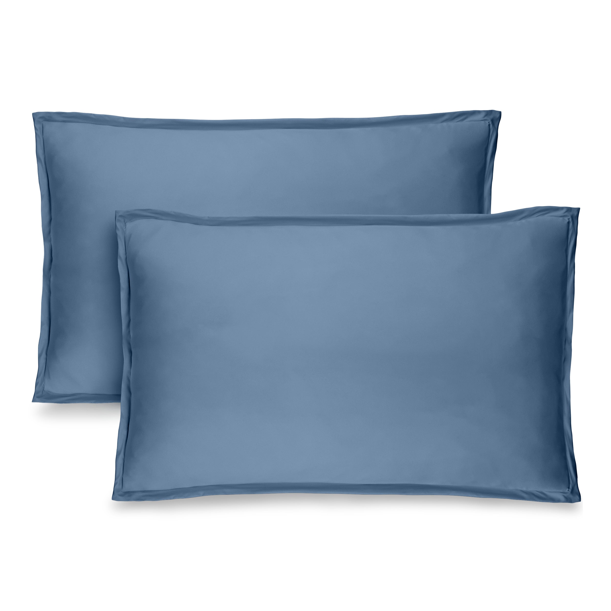 Two pillow shams on pillows standing up with one behind the other