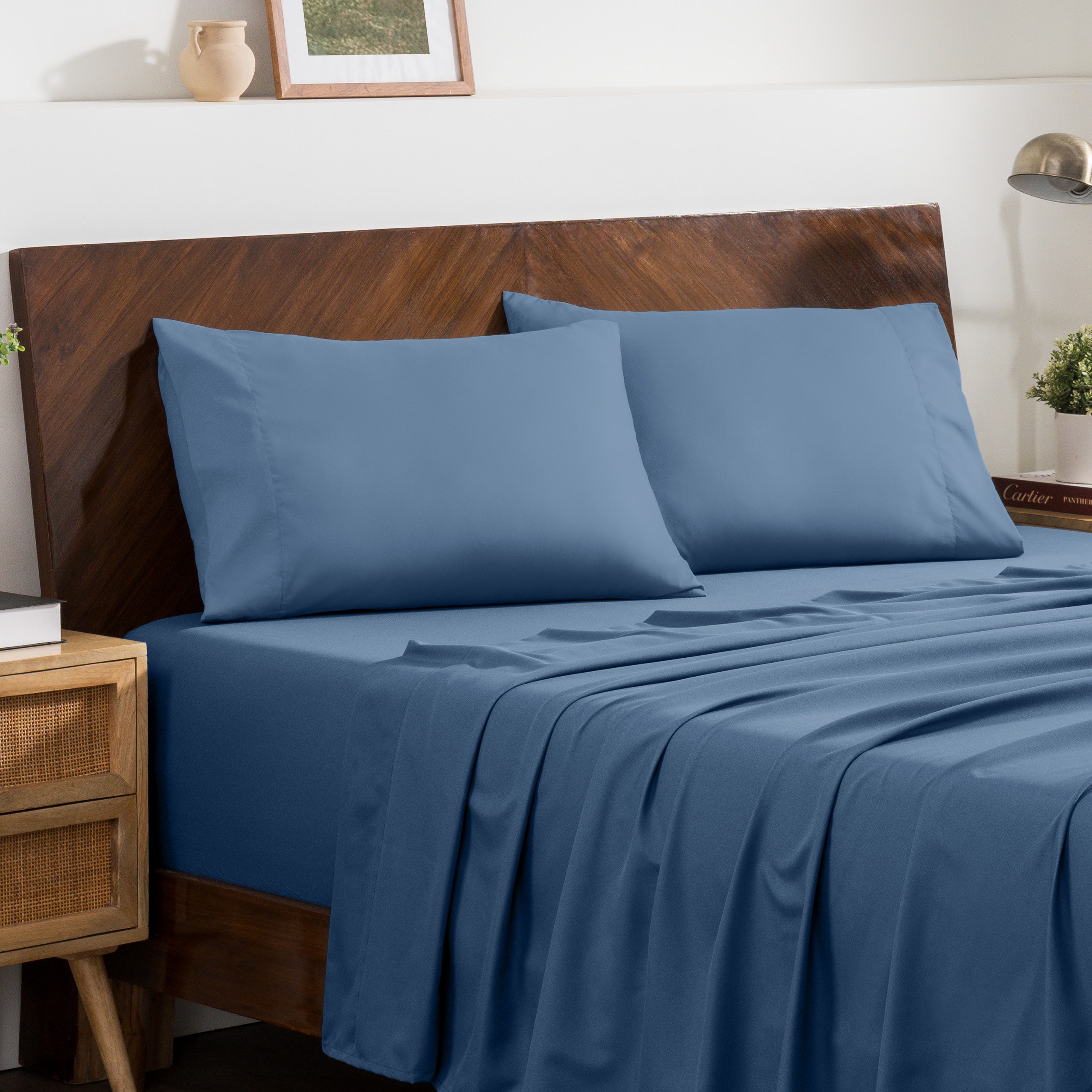 2 pillowcases on pillows on a nicely made bed