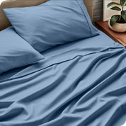 Close up of microfiber extra deep pocket sheets on a mattress

