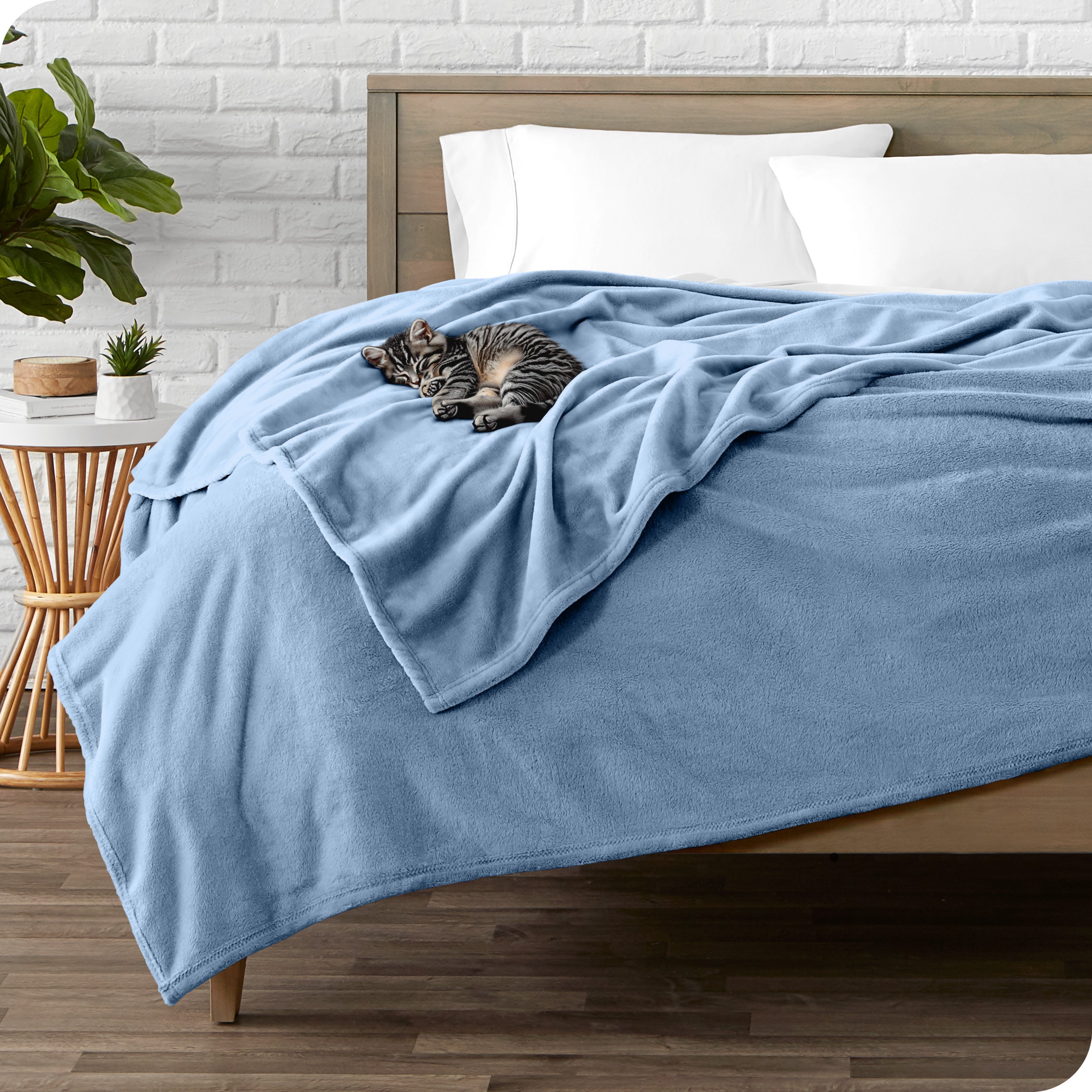 Microplush blanket laid out over a bed and folded back over itself