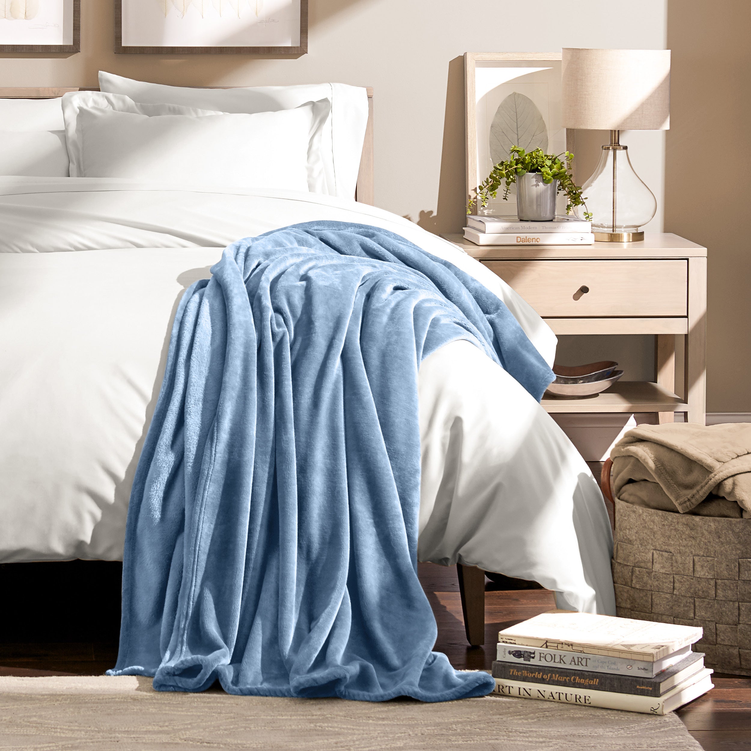 Microplush blanket laid out over a bed and folded back over itself