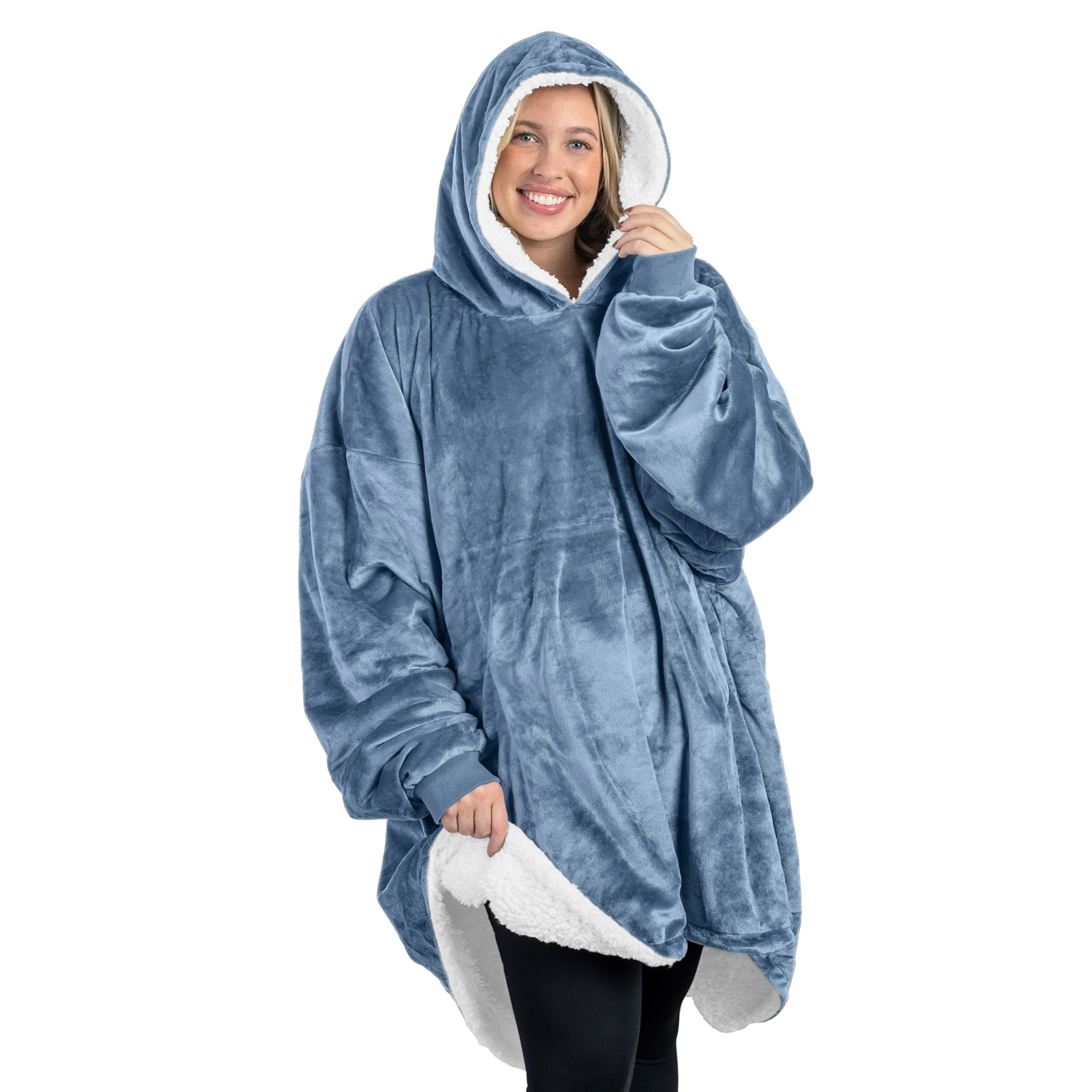 An adult with a sherpa wearable blanket on