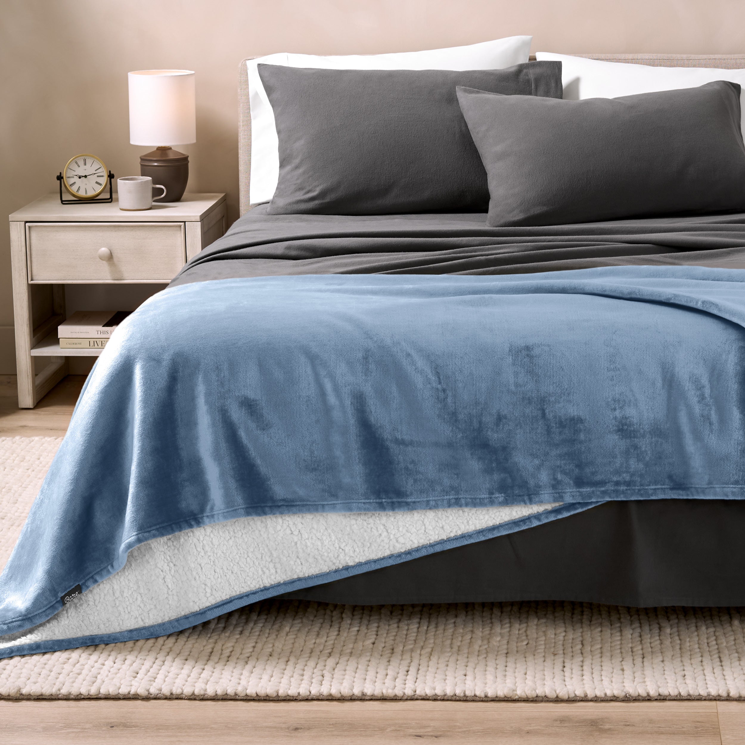 Sherpa Blanket laying on a bed folded over itself part way