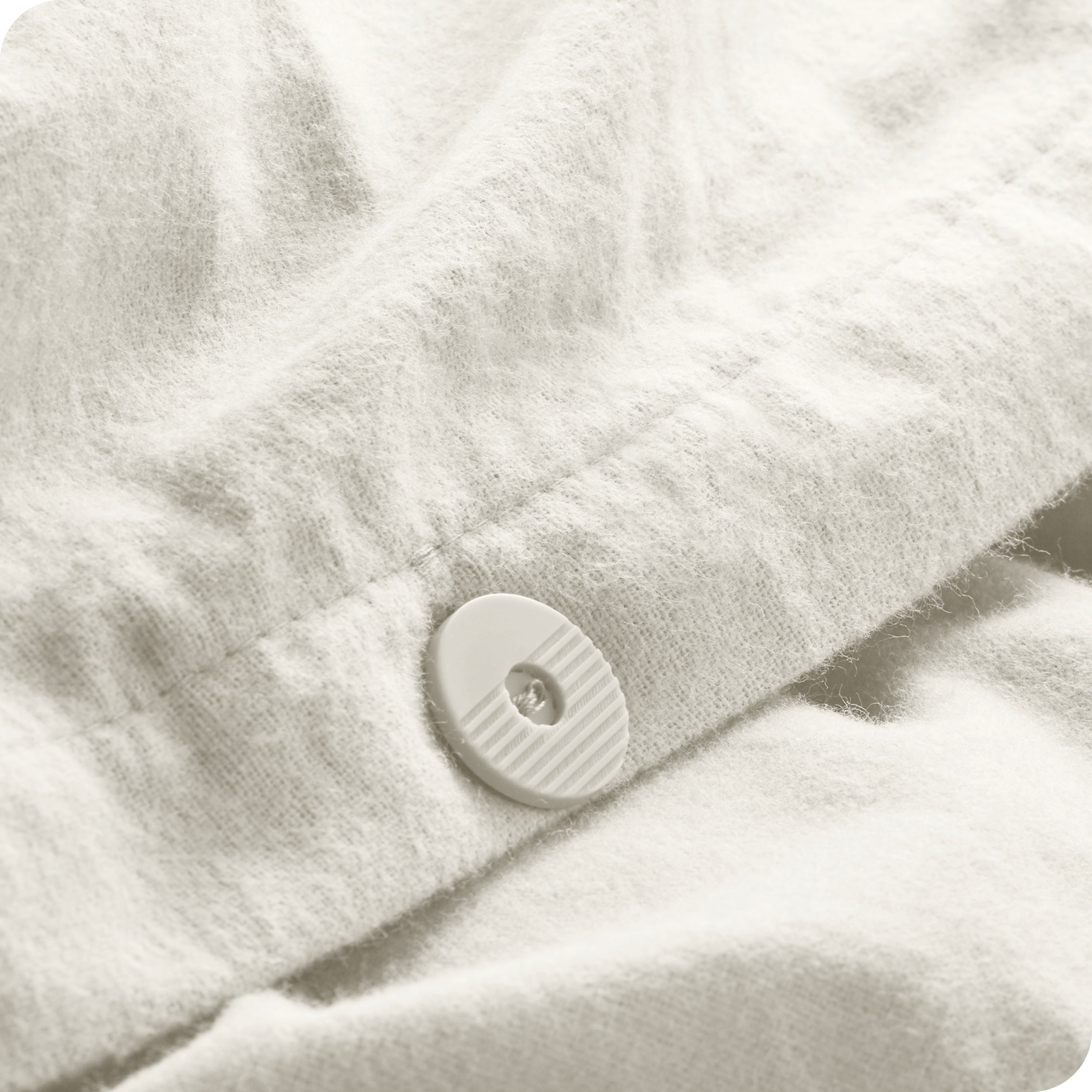 A close up of the tie corner of the duvet cover.
