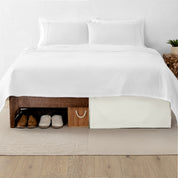 A split image showing a bed without a bed skirt on the left and with a bed skirt on the right.