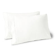 Two pillows on a white background with blue pillowcases on them