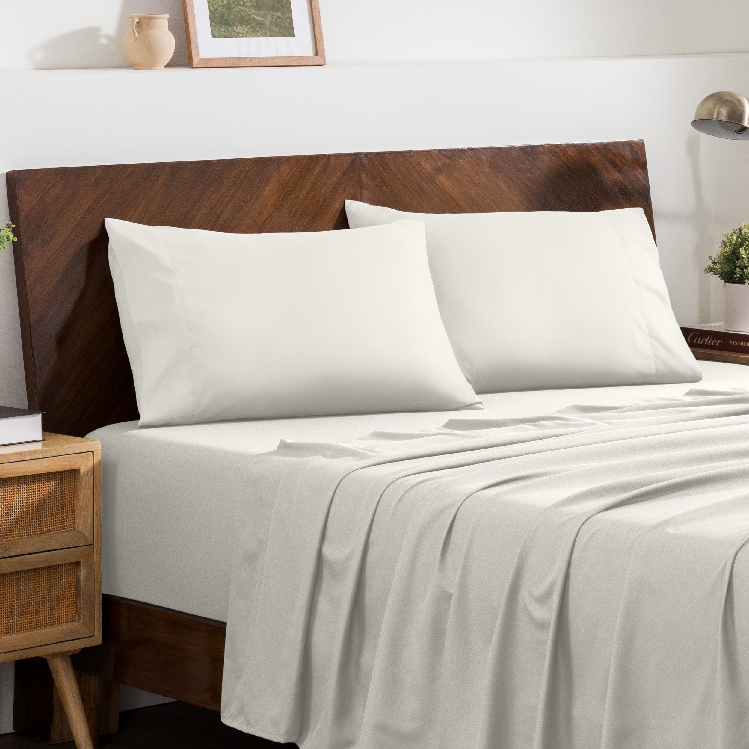 2 pillowcases on pillows on a nicely made bed