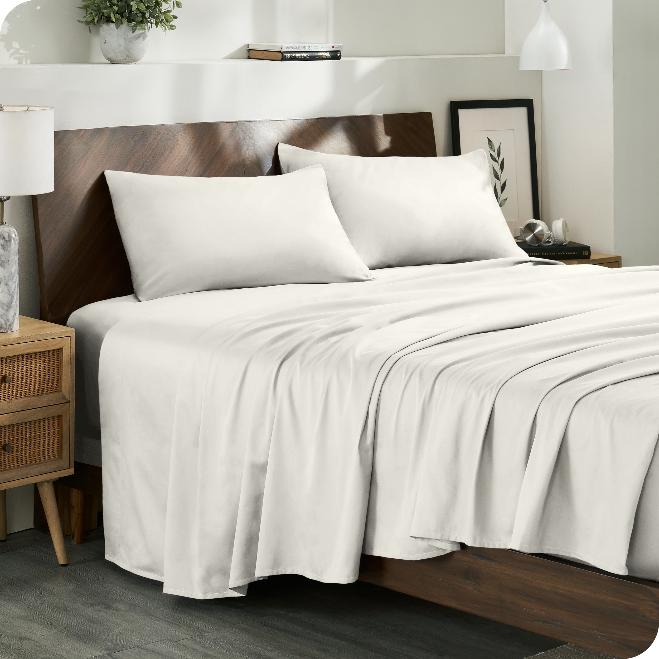 Diagonal view of a decorated room scene with sateen sheets