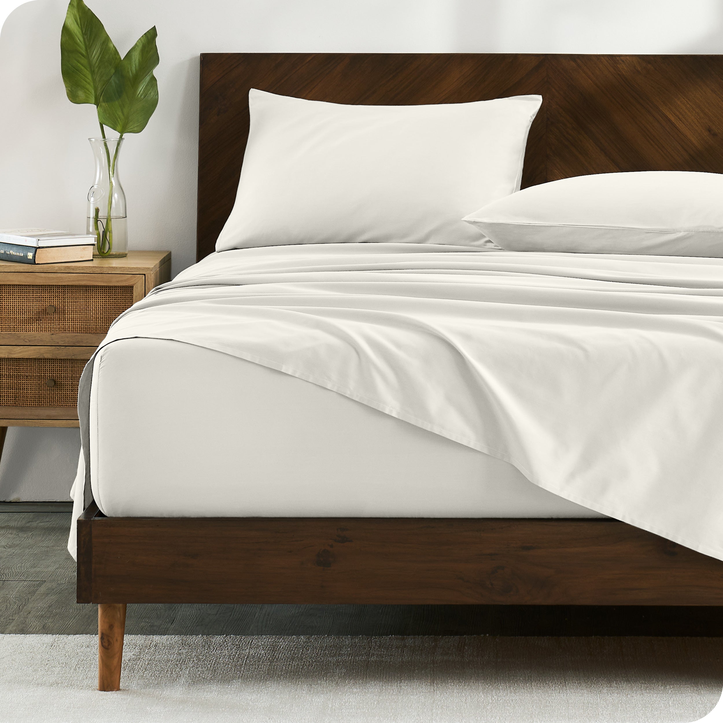 Percale sheets on bed in a modern bedroom