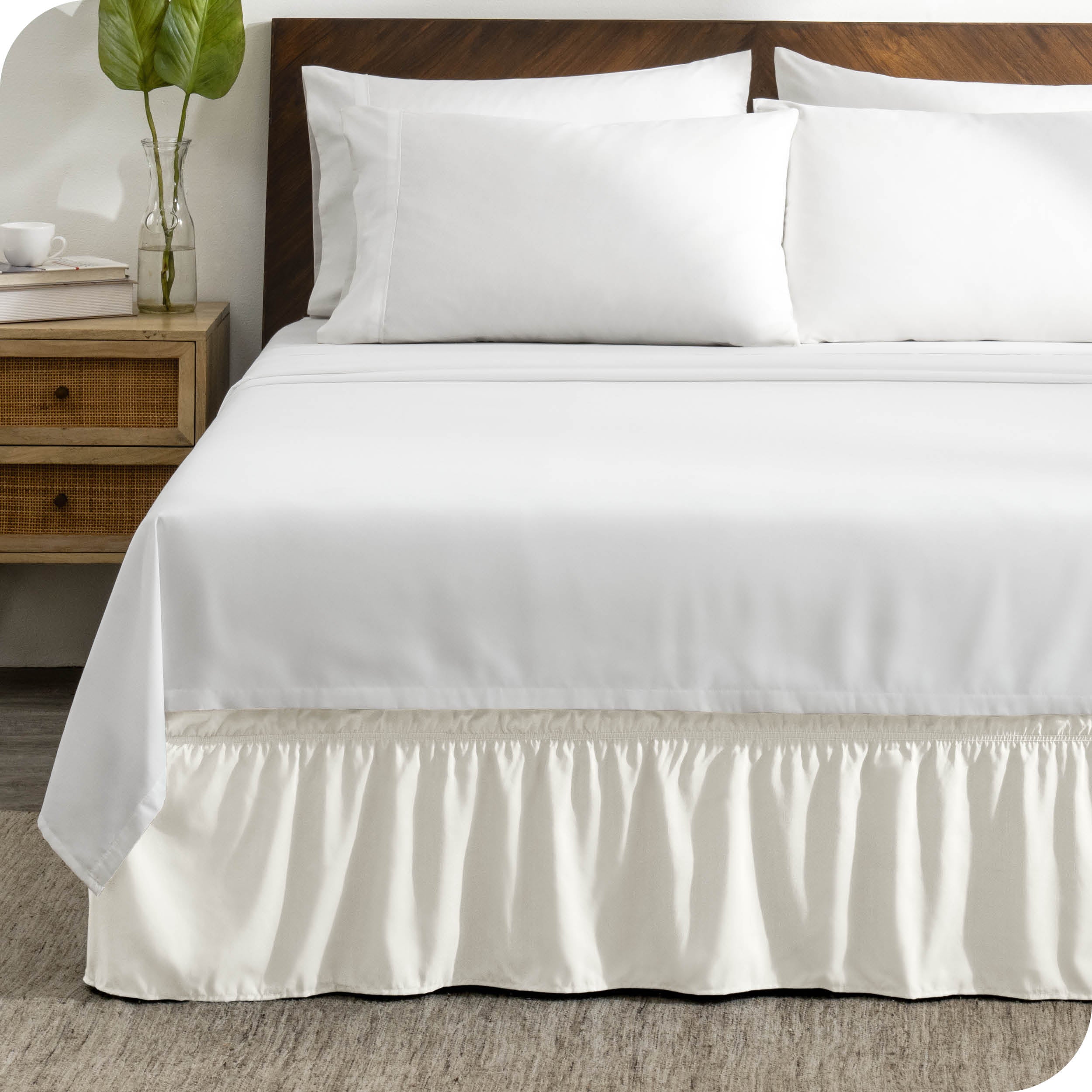 A wrap around bed skirt on a bed