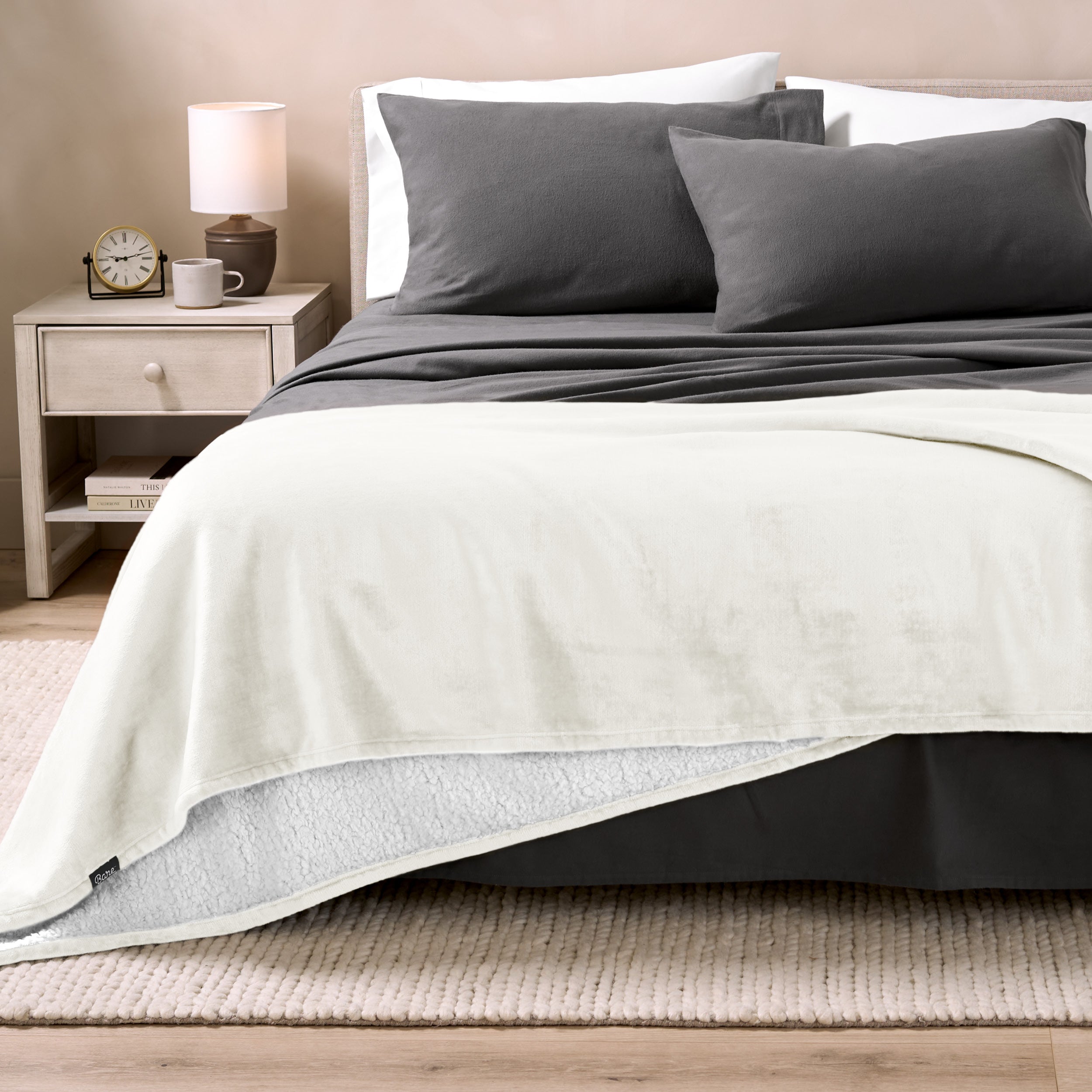 Sherpa Blanket laying on a bed folded over itself part way