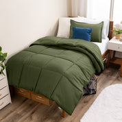 A modern bed with a down alternative comforter set on it
