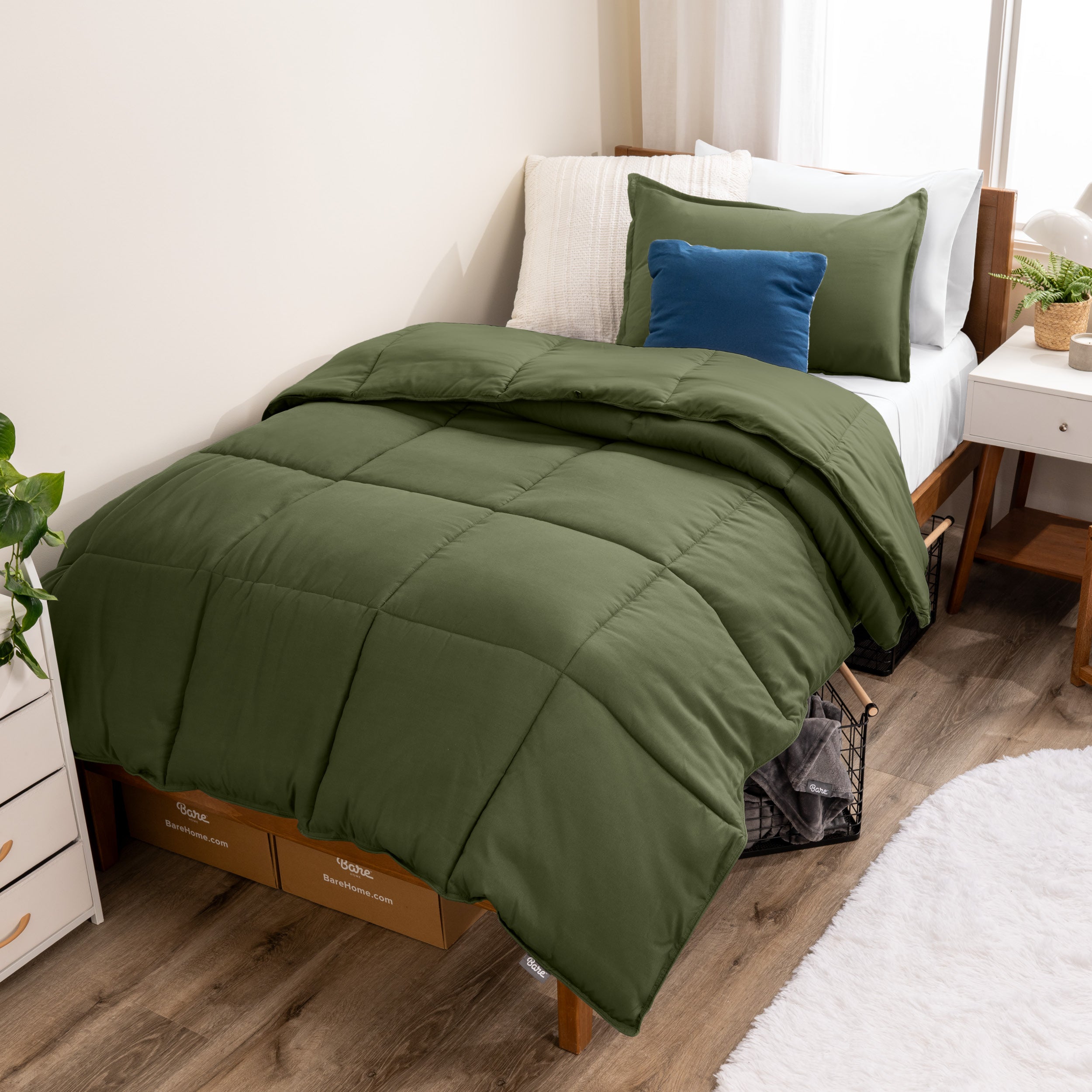 A modern bed with a down alternative comforter set on it