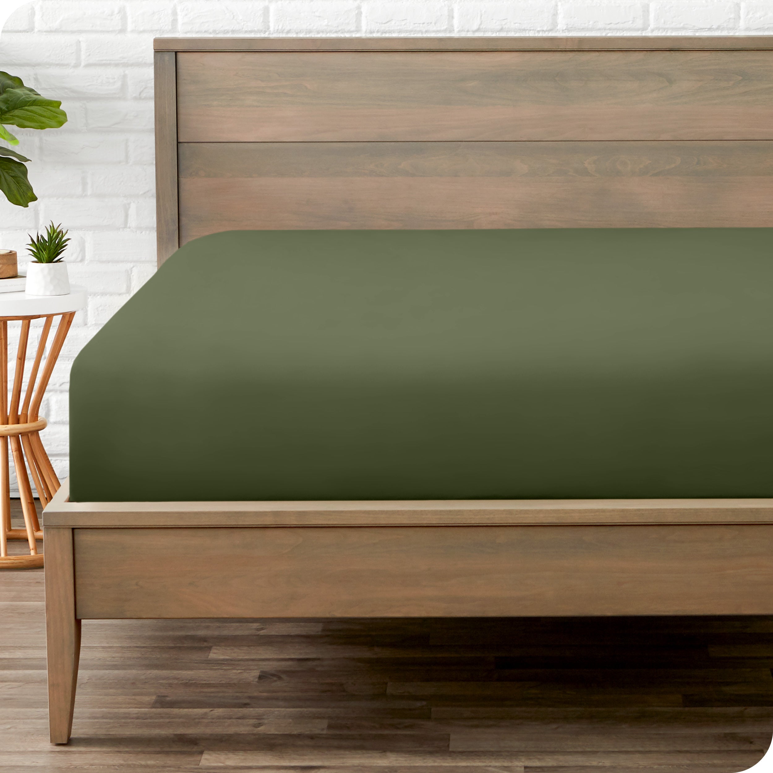 End of bed view with fitted sheet made on the mattress of a modern bed. 