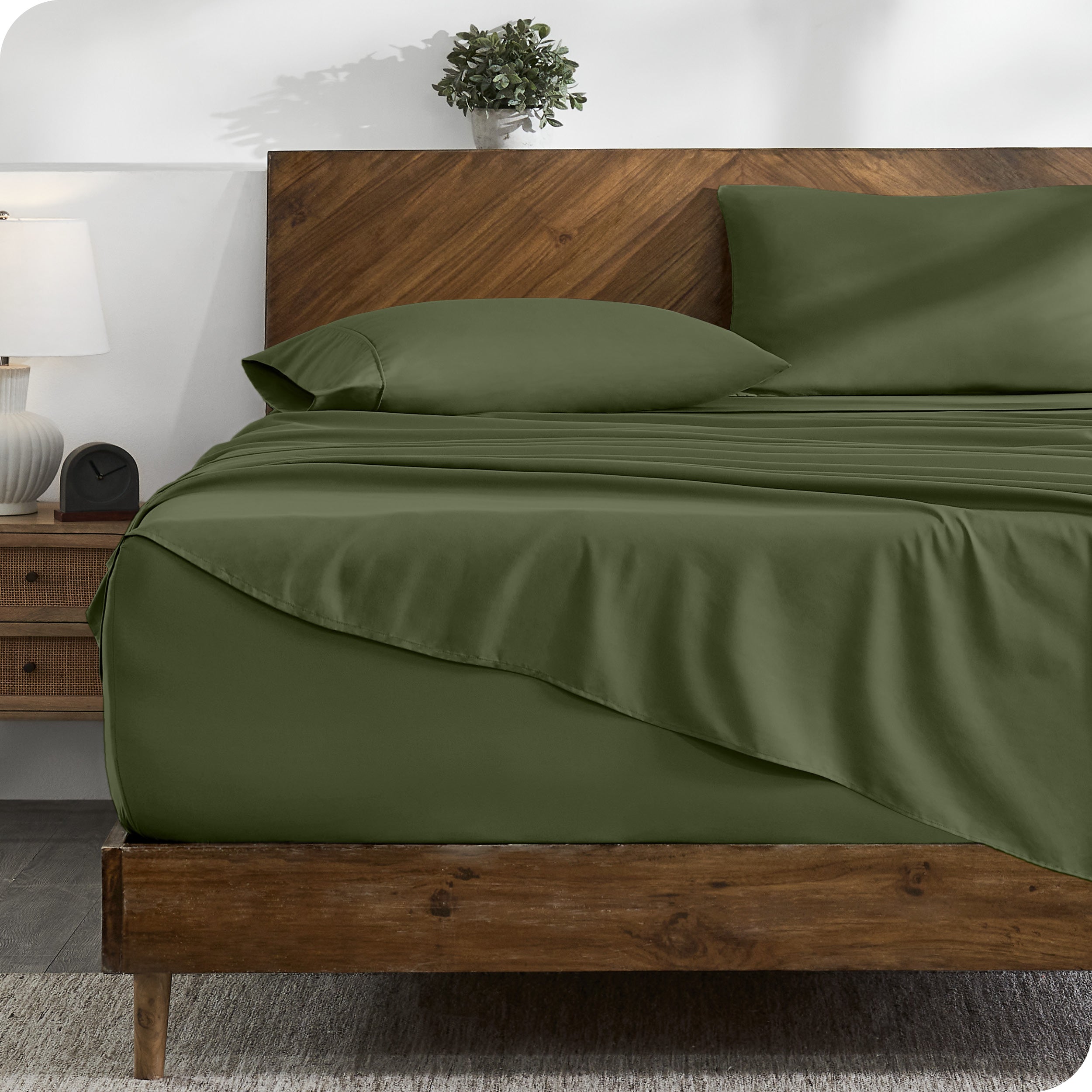 A cozy bedroom with a bed covered in soft microfiber sheets

