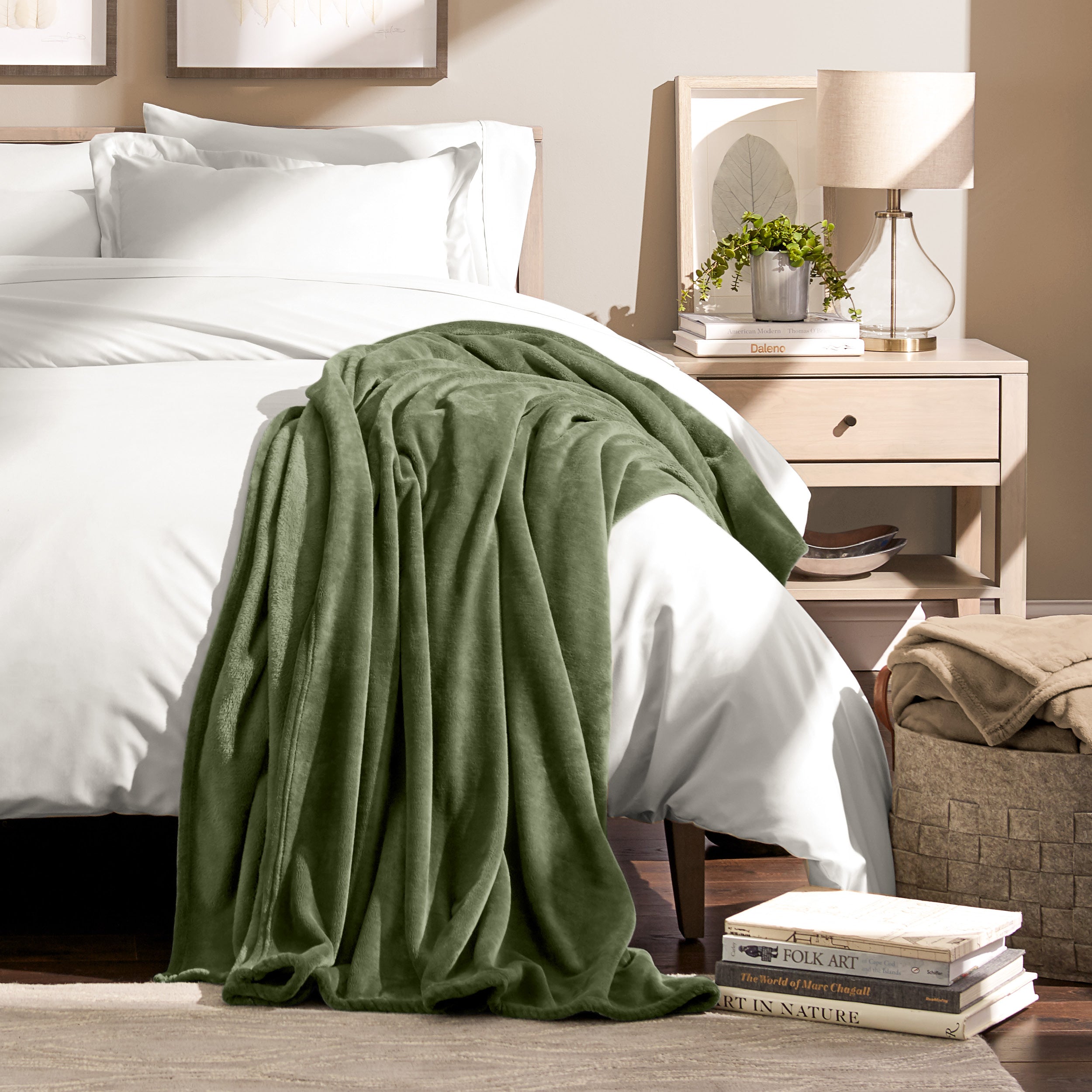 Microplush blanket laid out over a bed and folded back over itself