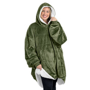 An adult with a sherpa wearable blanket on