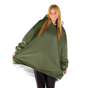An adult with a sherpa wearable blanket on