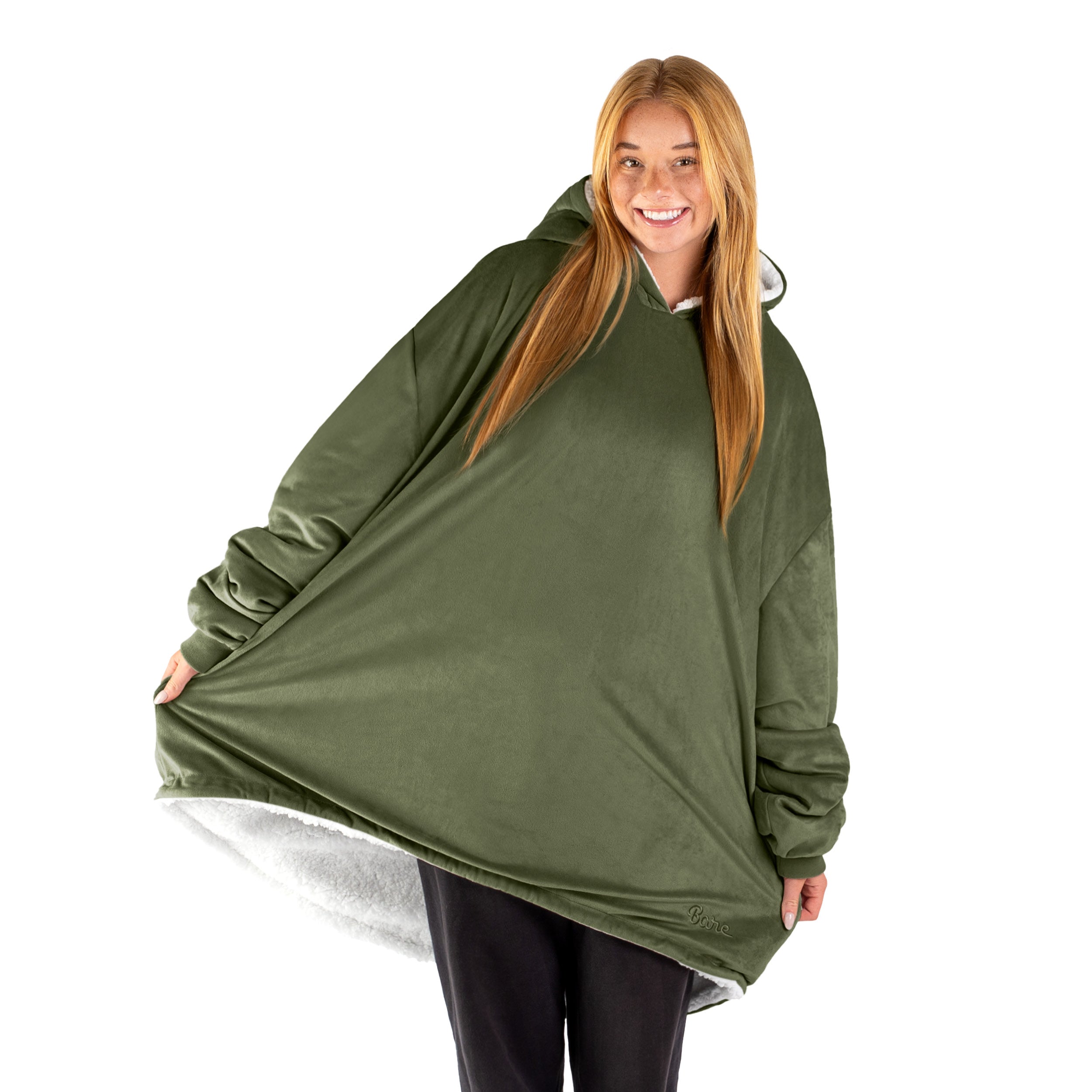An adult with a sherpa wearable blanket on