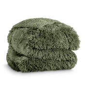 A shaggy faux fur blanket folded