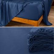 Bamboo fitted sheet on a wooden bed with a close-up of the folded sheet below.