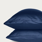 Two bamboo pillowcases on a light gray background