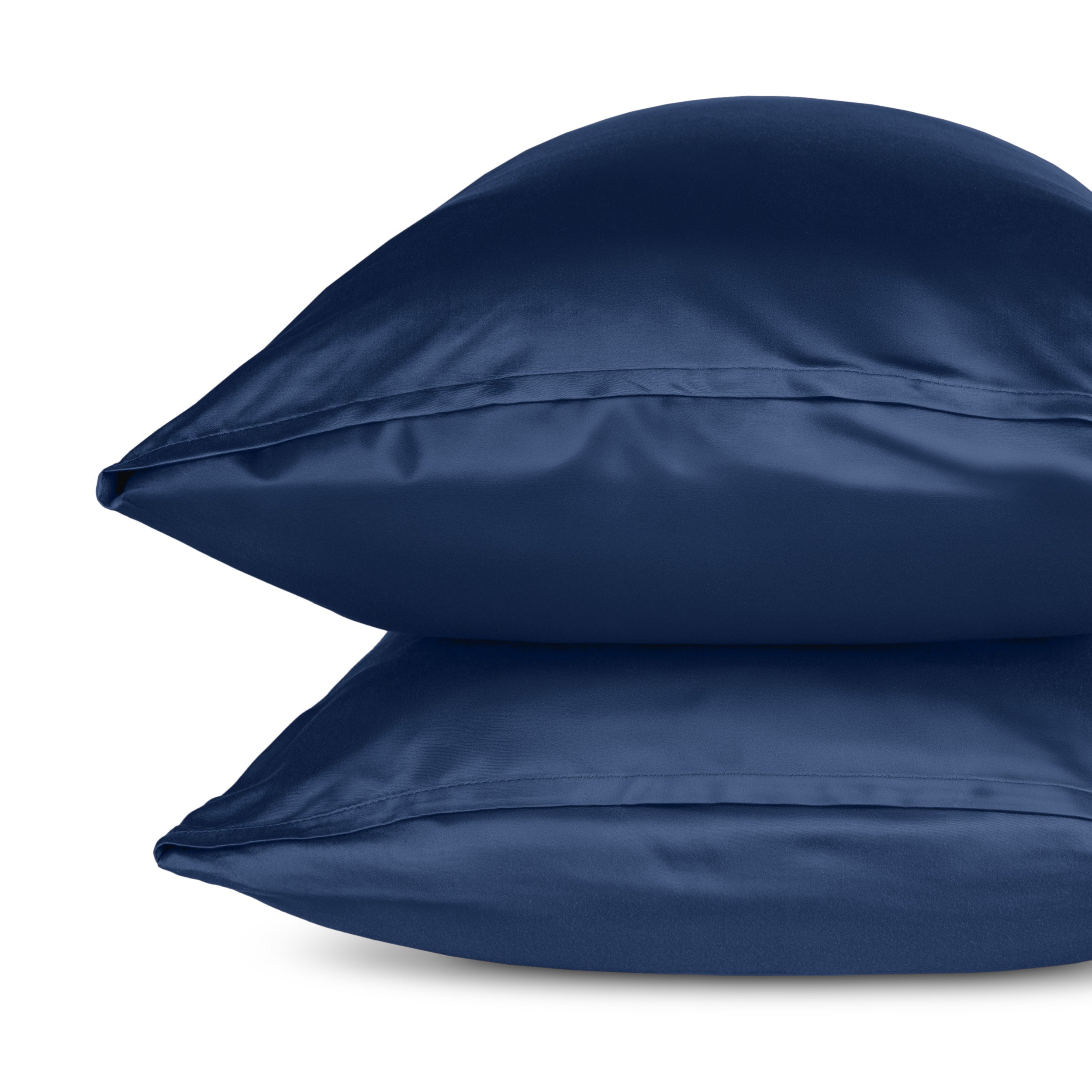 Two pillows with pillowcases stacked on a white background